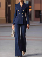 Women's pinstripe two-piece pantsuit with double-breasted blazer, decorative buttons and matching wide-leg trousers.