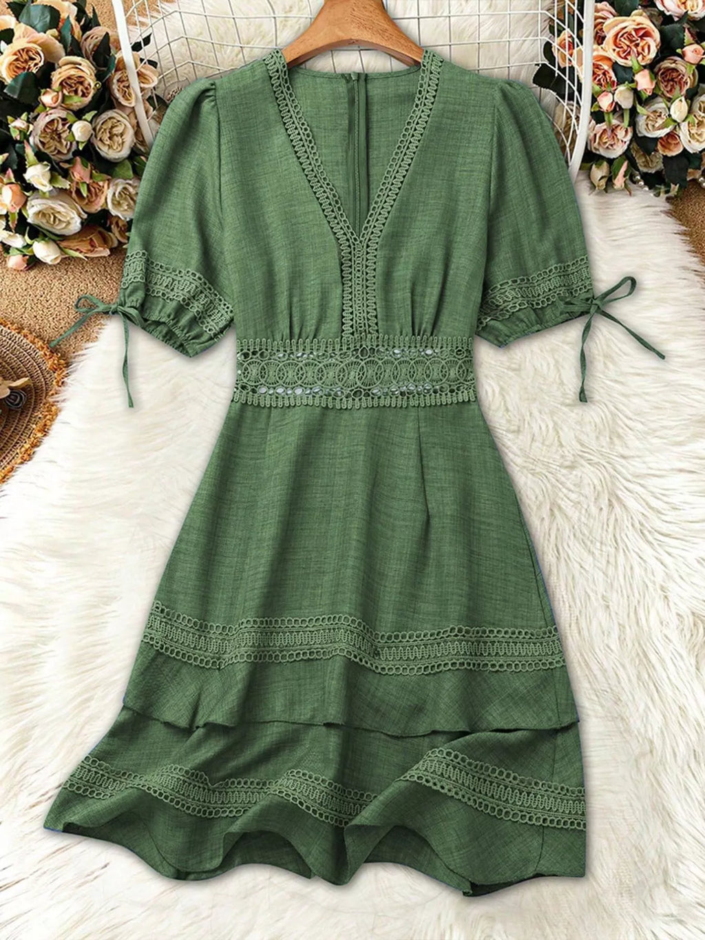 Women's lace-detail V-neck mini dress with tie-accent puff sleeves, defined waist and layered ruffle hem.