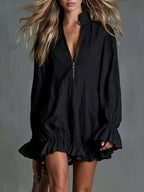 Women's zip-front mini dress with relaxed fit, long sleeves, ruffled cuffs and flared ruffle hem.