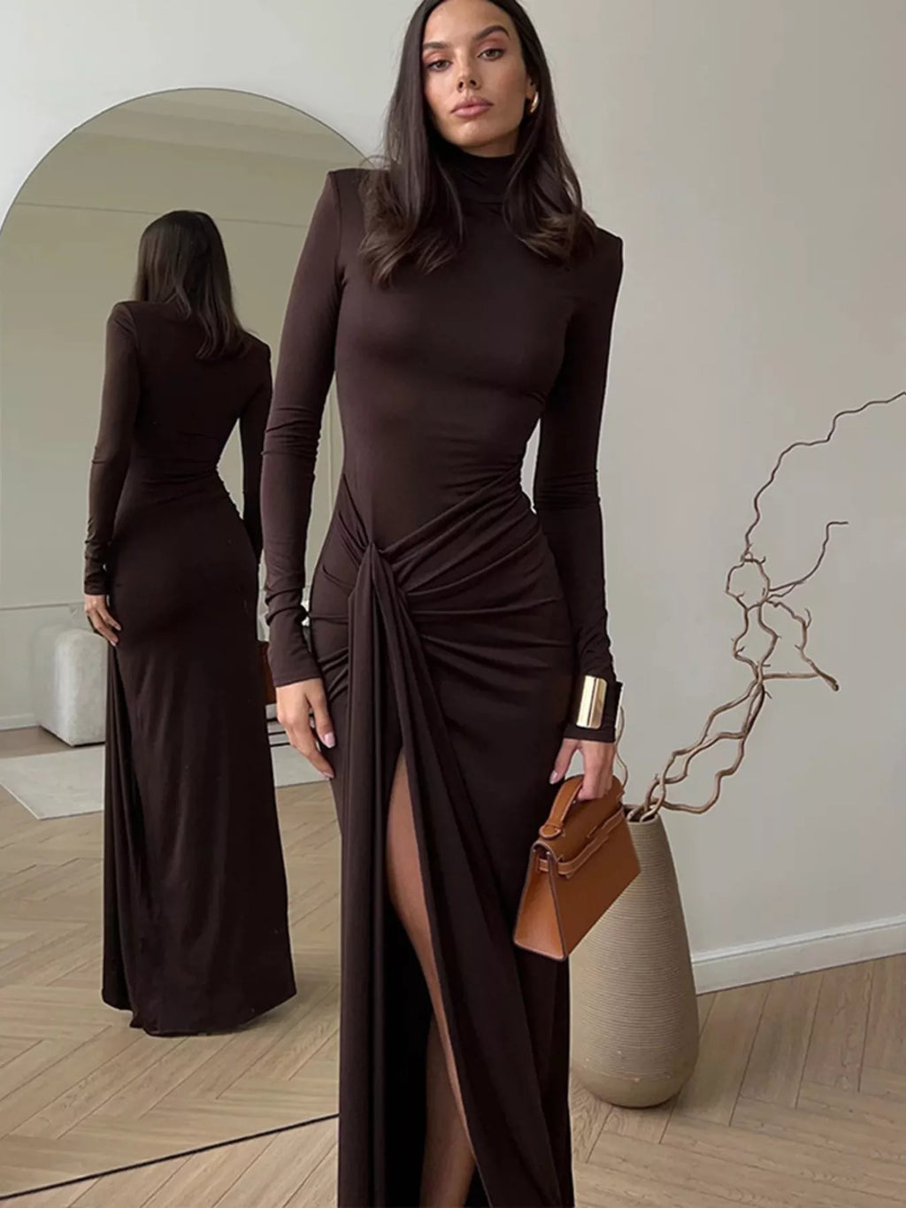 Women's long-sleeve turtleneck maxi dress with ruched tie-waist detail, draped silhouette and thigh-high side slit.