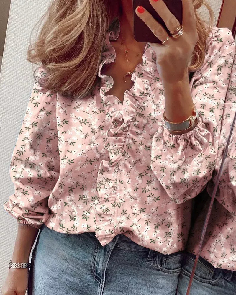 Women's pink floral print V-neck blouse with ruffled neckline and gathered long sleeves