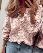 Women's pink floral print V-neck blouse with ruffled neckline and gathered long sleeves