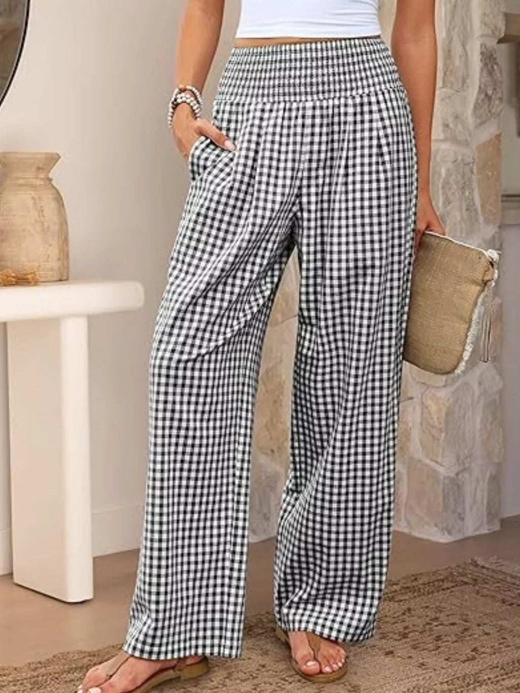 Women's gingham plaid wide-leg casual pants featuring a smocked elastic waistband, relaxed silhouette and functional pockets.