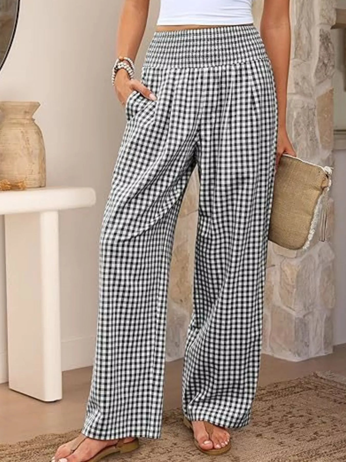 Women's gingham plaid wide-leg casual pants featuring a smocked elastic waistband, relaxed silhouette and functional pockets.