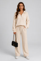 Women's ribbed knit two-piece lounge set with collared quarter-zip pullover and matching drawstring wide-leg pants with pockets.