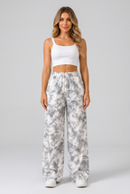 Women's light gray printed wide-leg pants collage highlighting the abstract pattern, elastic waistband, pockets and relaxed silhouette.