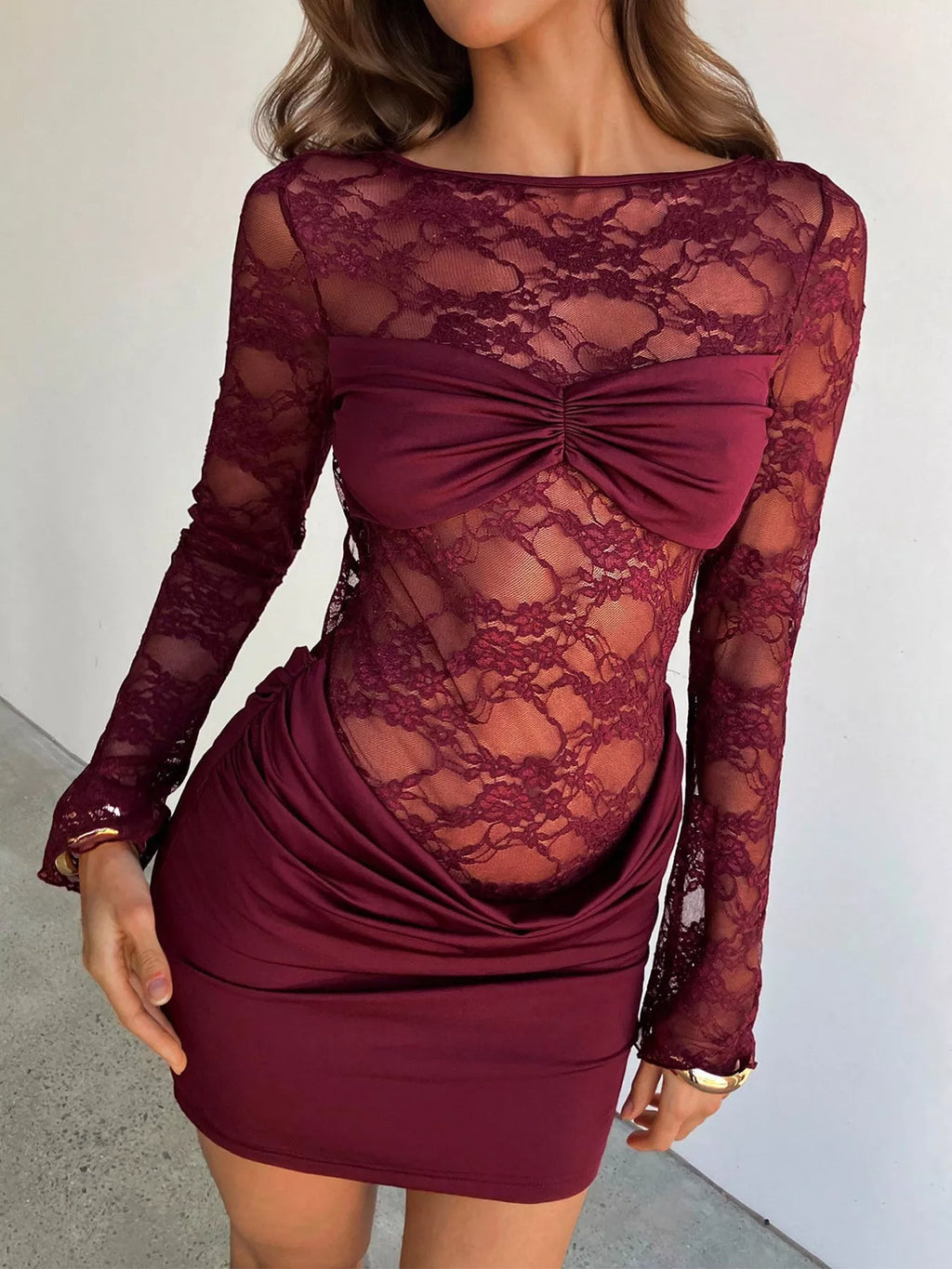 Women's wine red lace bodycon mini dress with sheer floral lace long sleeves, cutout back and ruched skirt.
