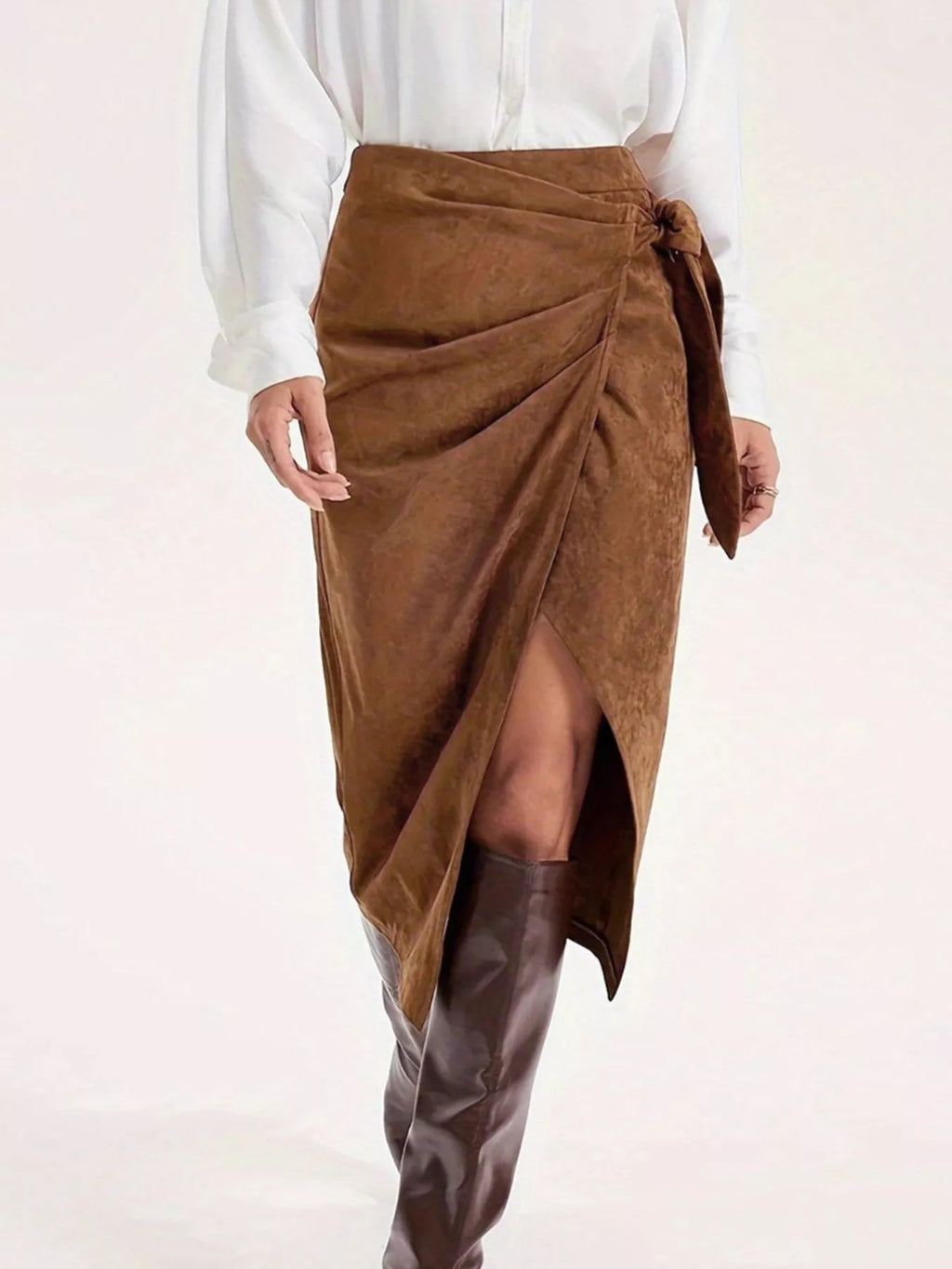 Women's brown wrap-style midi skirt featuring an elegant side tie, side slit and draped silhouette.
