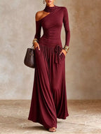 Women's long-sleeve maxi dress with asymmetrical shoulder cutout, high neckline, adjustable drawstring waist and side pockets.